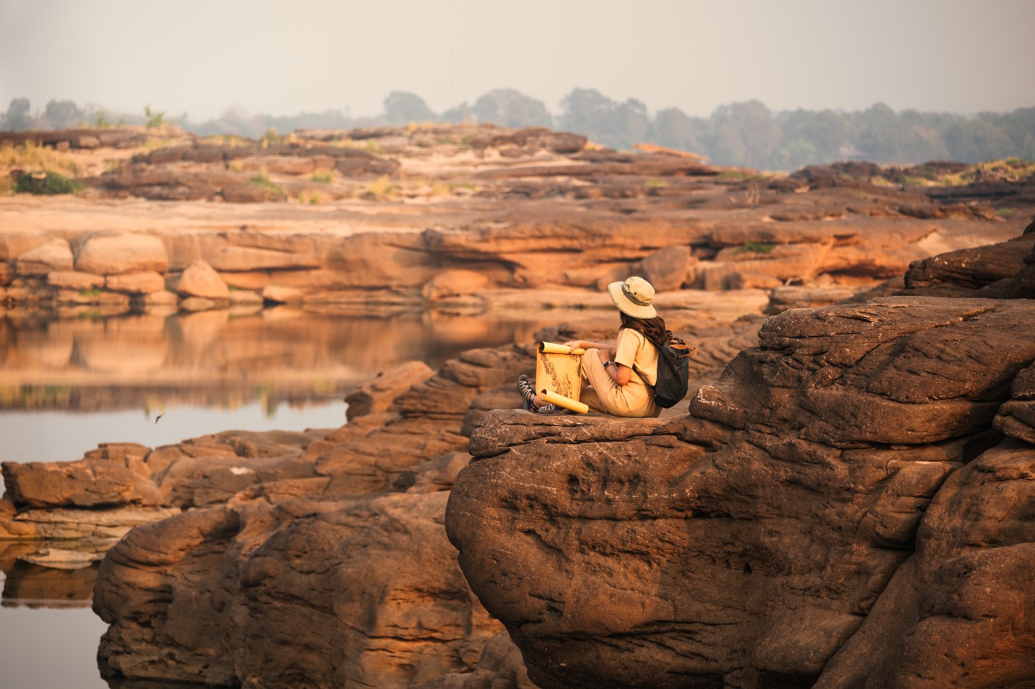 asian-woman-explorer-sitting-rock-cliff-with-looking-paper-map-sam-phan-bok-gran.jpg