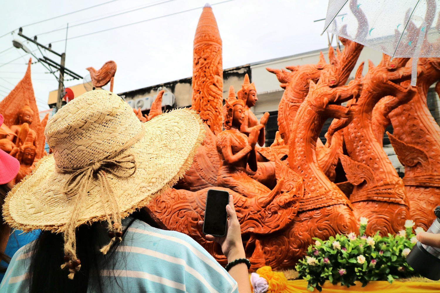 female-tourist-take-photo-large-candle-with-mobile-phone-ubon-ratchathani-candle.jpg