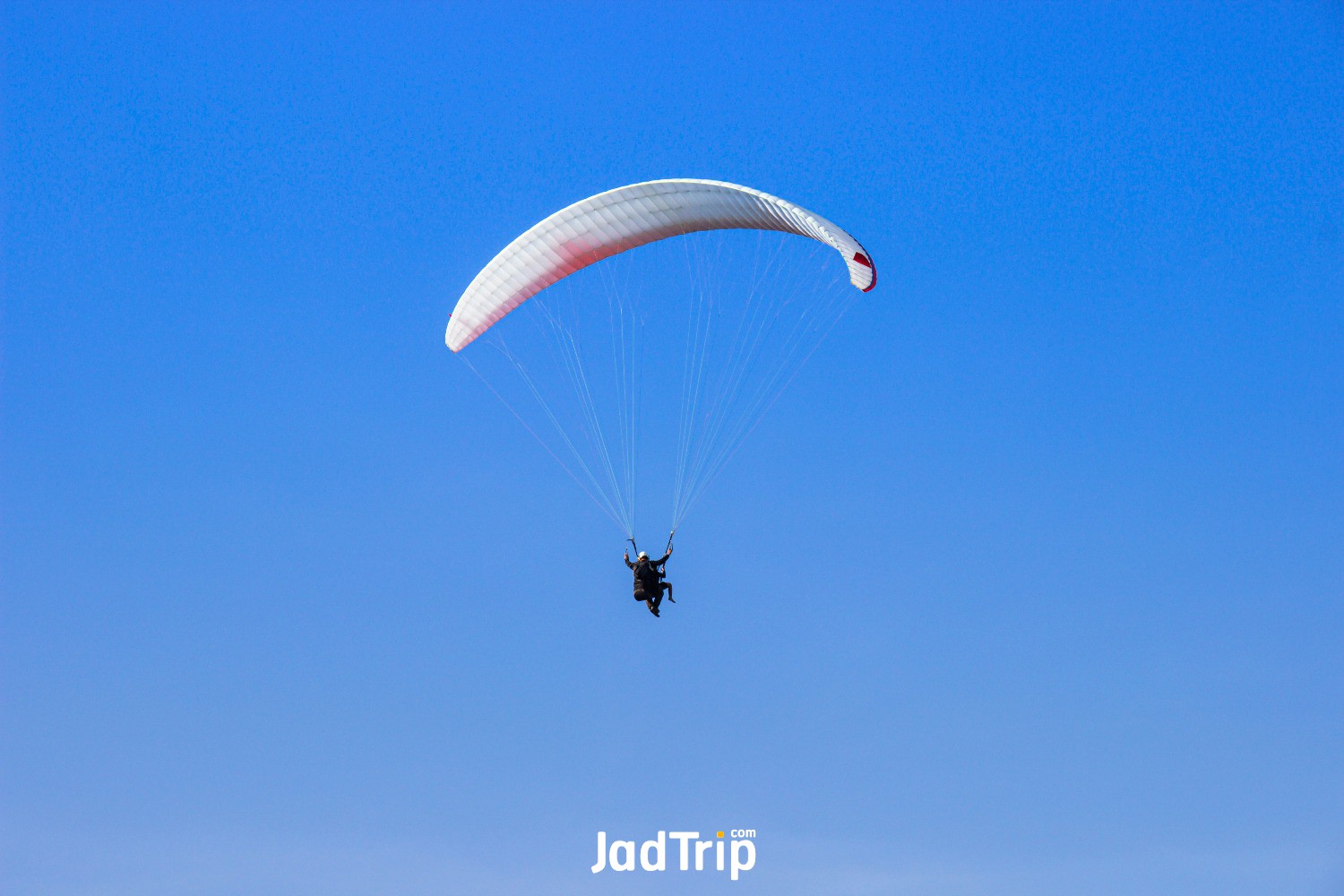 tourist-flying-paraglider-blue-sky-bight-day.jpg