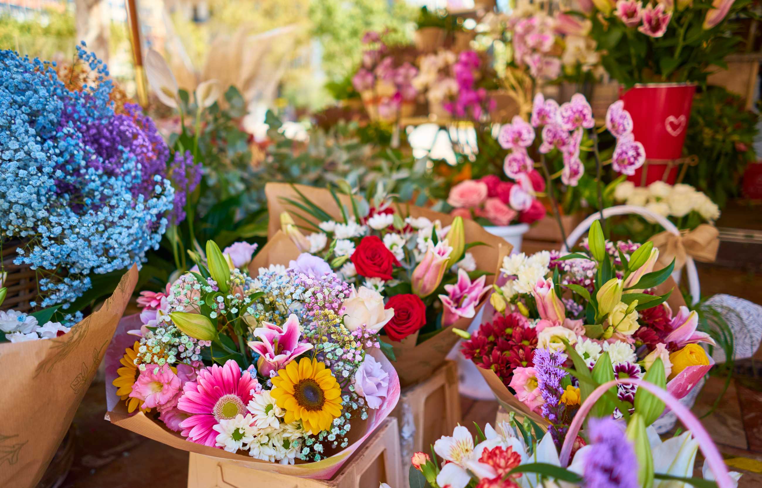 closeup-colorful-flower-bouquets-containers-outdoor-shop.jpg